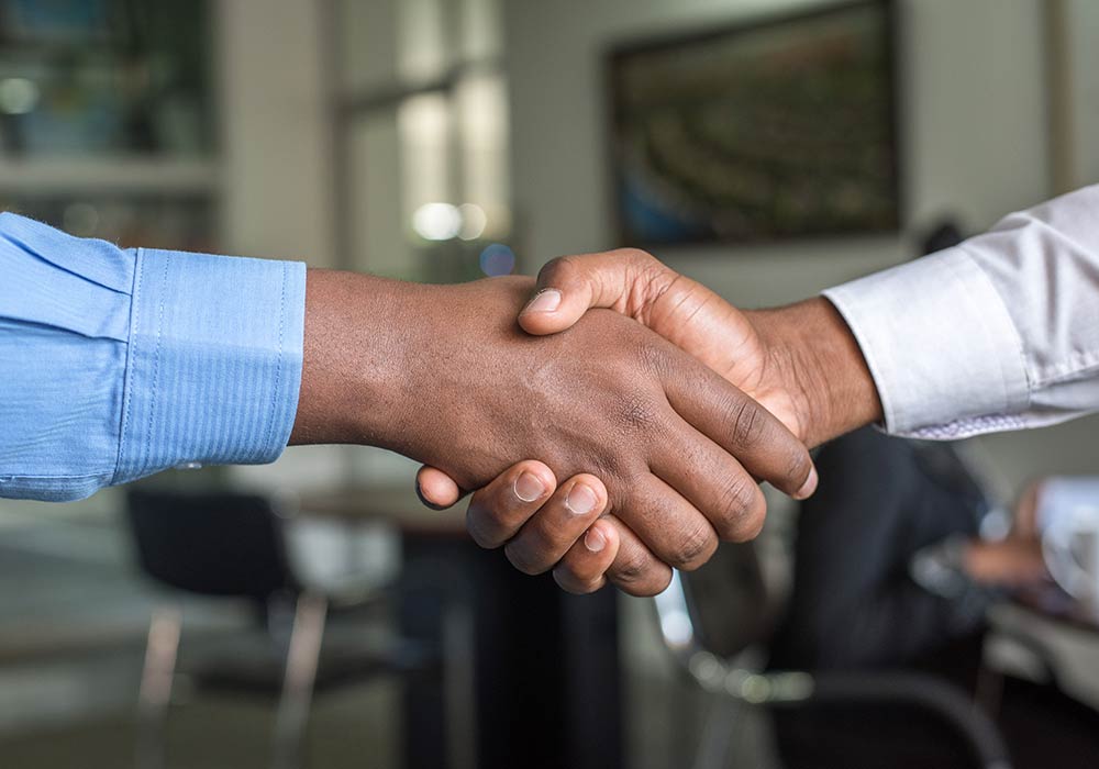Black Men Shaking Hands | Closing Costs for Residential Real Estate Transactions